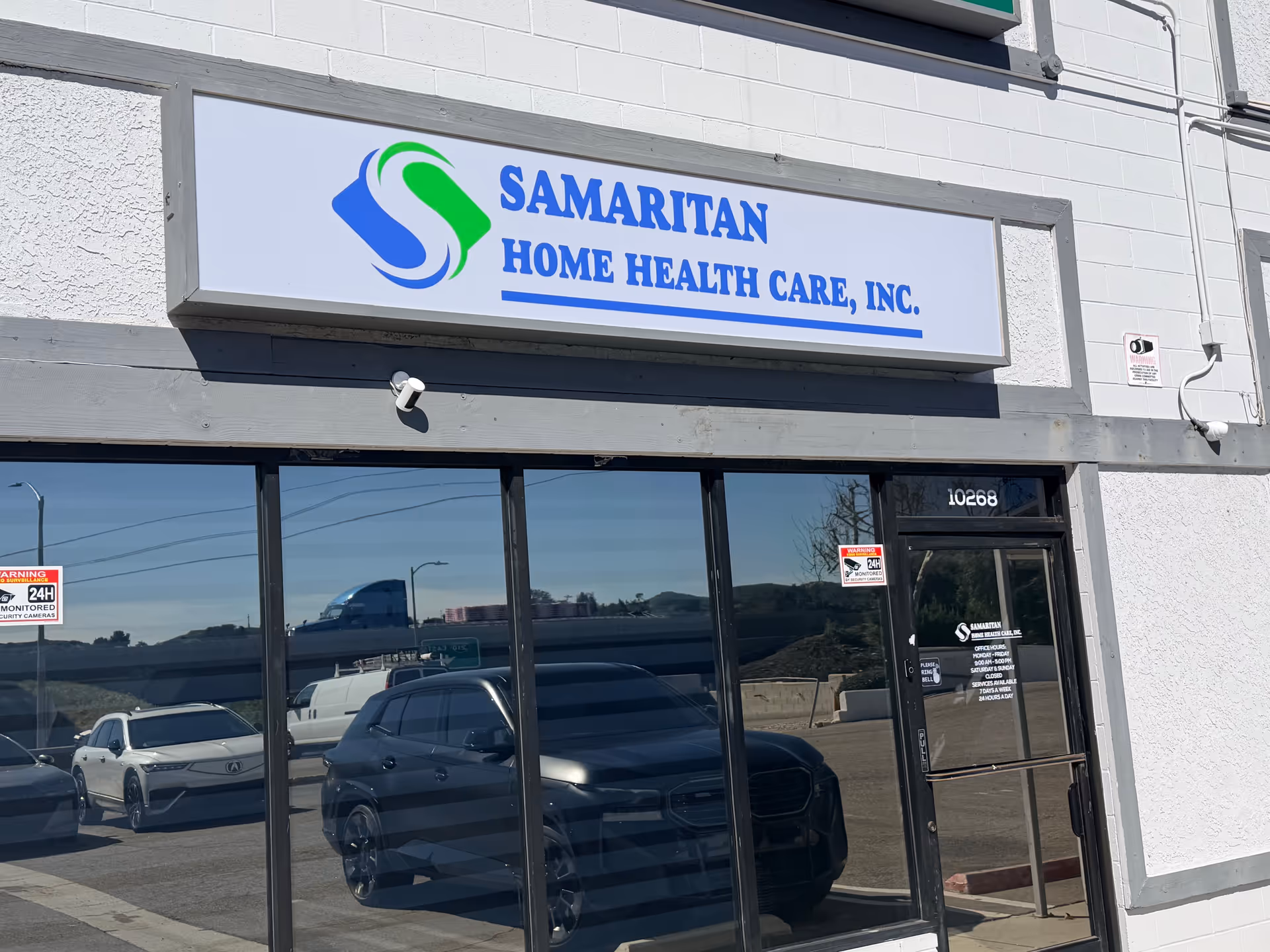 Front exterior of Samaritan Home Health Care, Inc. building with sign and glass windows.