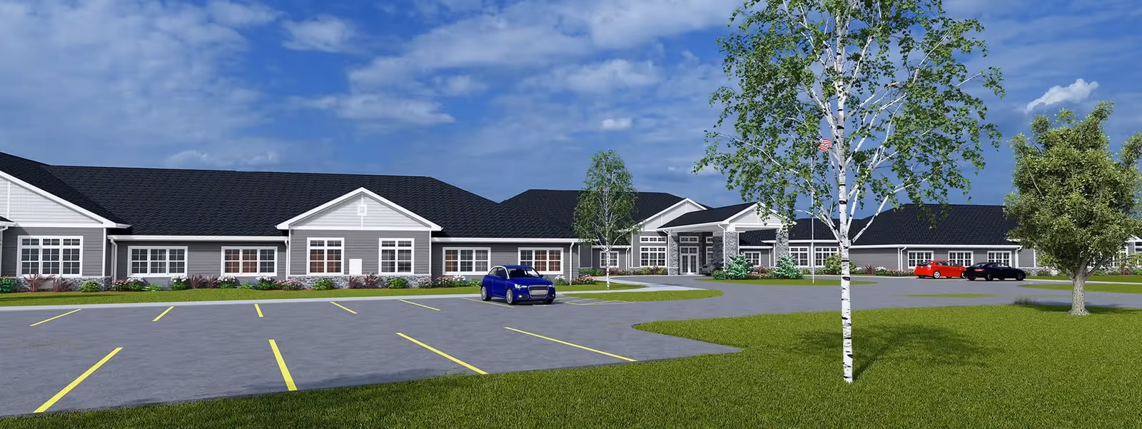Exterior view of The Courtyard at Wyoming, a single-story facility with parking and trees.