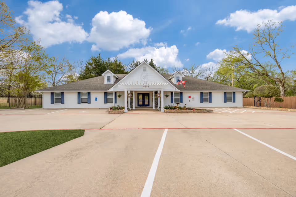 Exterior view of The Snowberry, a Bouquet Home, a single-story senior living facility.