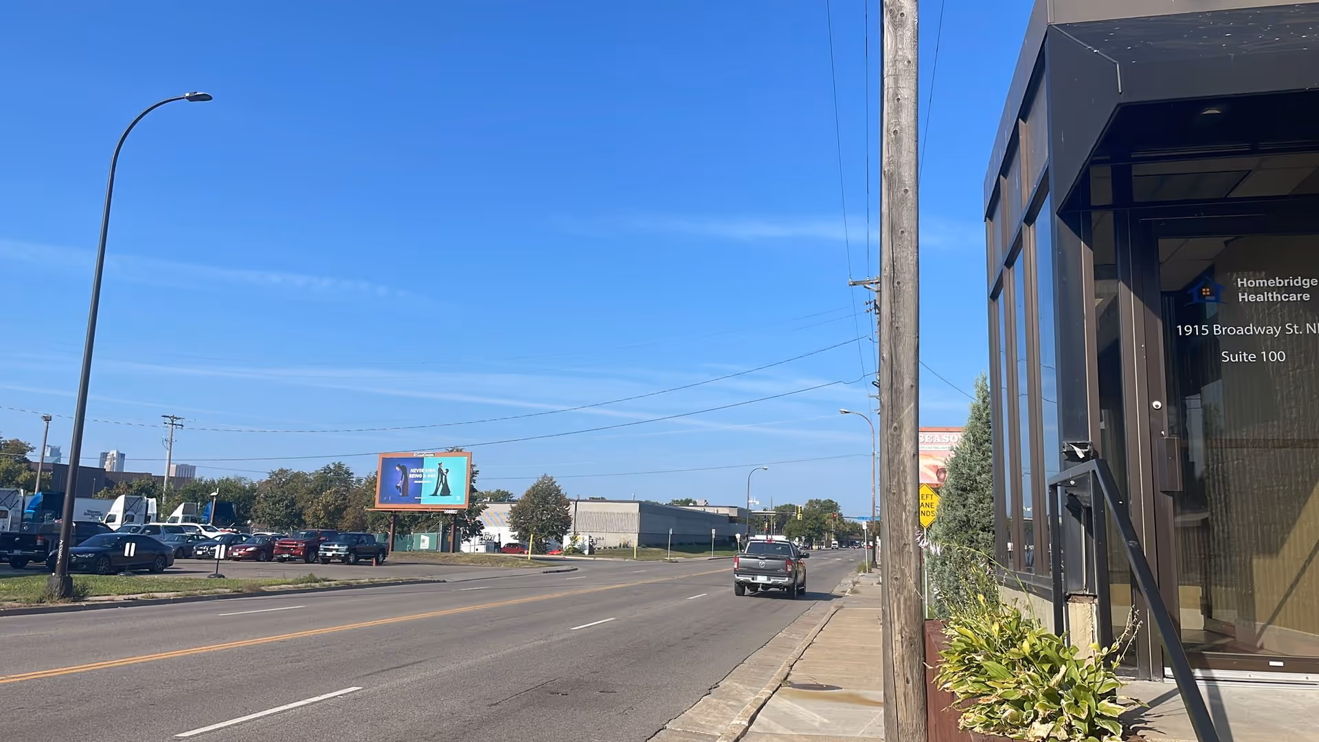 Exterior view of Homebridge Healthcare Services building along a street with cars.