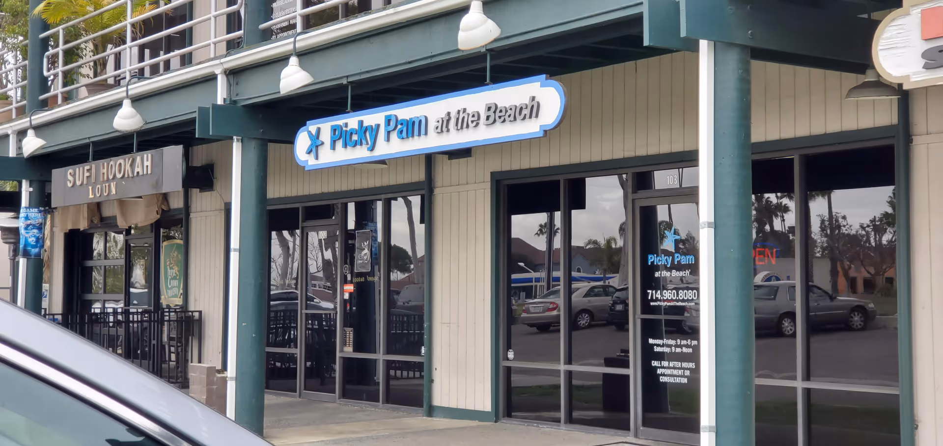 Exterior strip mall with Picky Pam at the Beach sign and other storefronts.