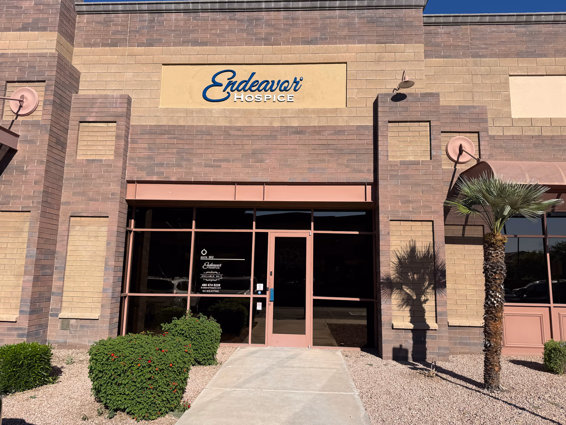 Front view of Endeavor Hospice entrance with brick facade and glass doors