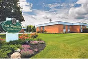 Sullivan Healthcare and Senior Living facility exterior with brick building and manicured lawn.