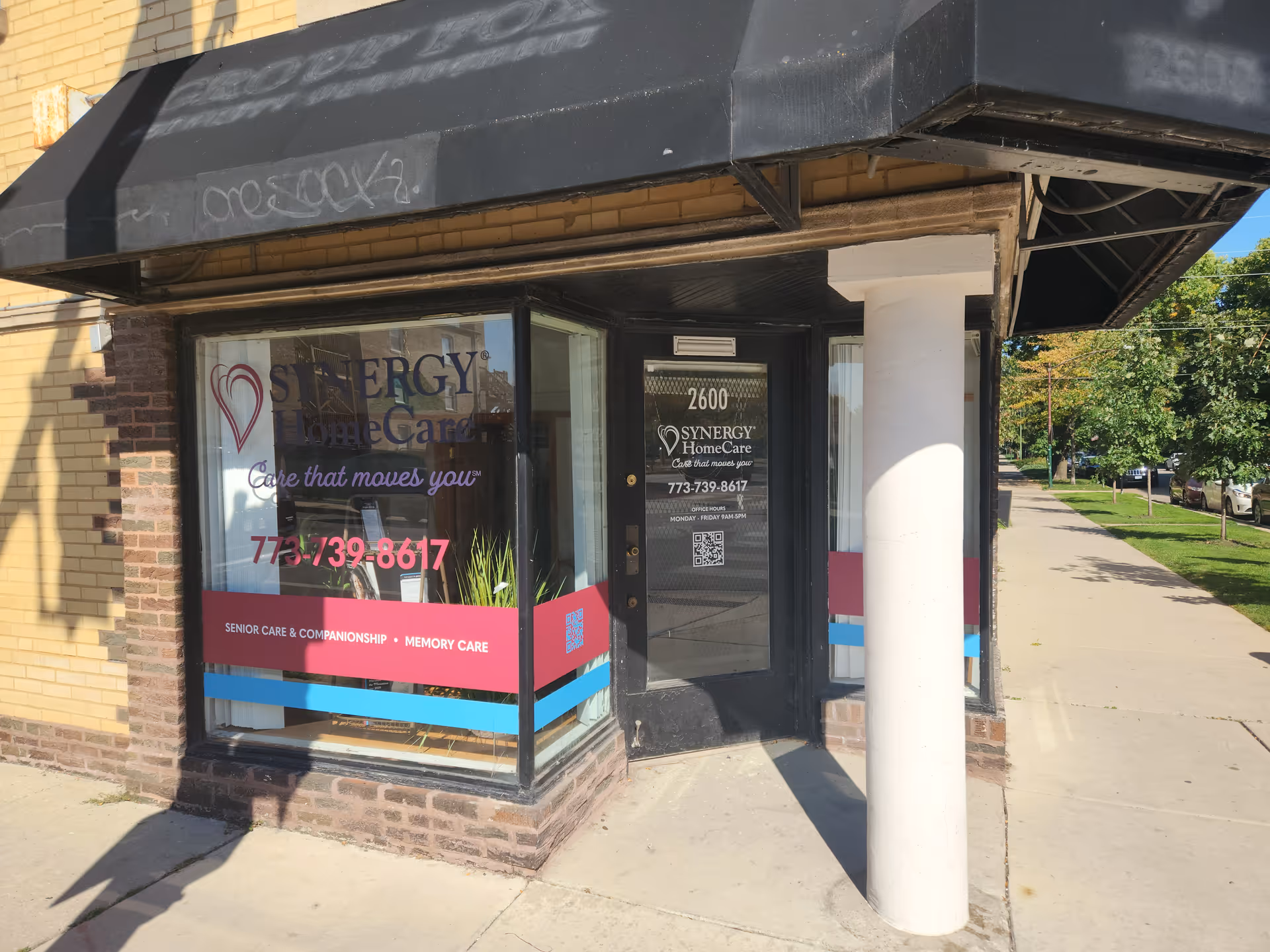 Storefront of SYNERGY HomeCare with glass windows, door, and bold signage.