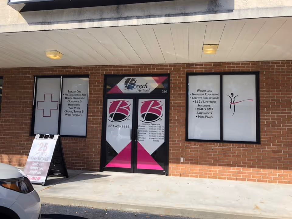 Brick storefront with glass doors and bright Beach Medical signs.