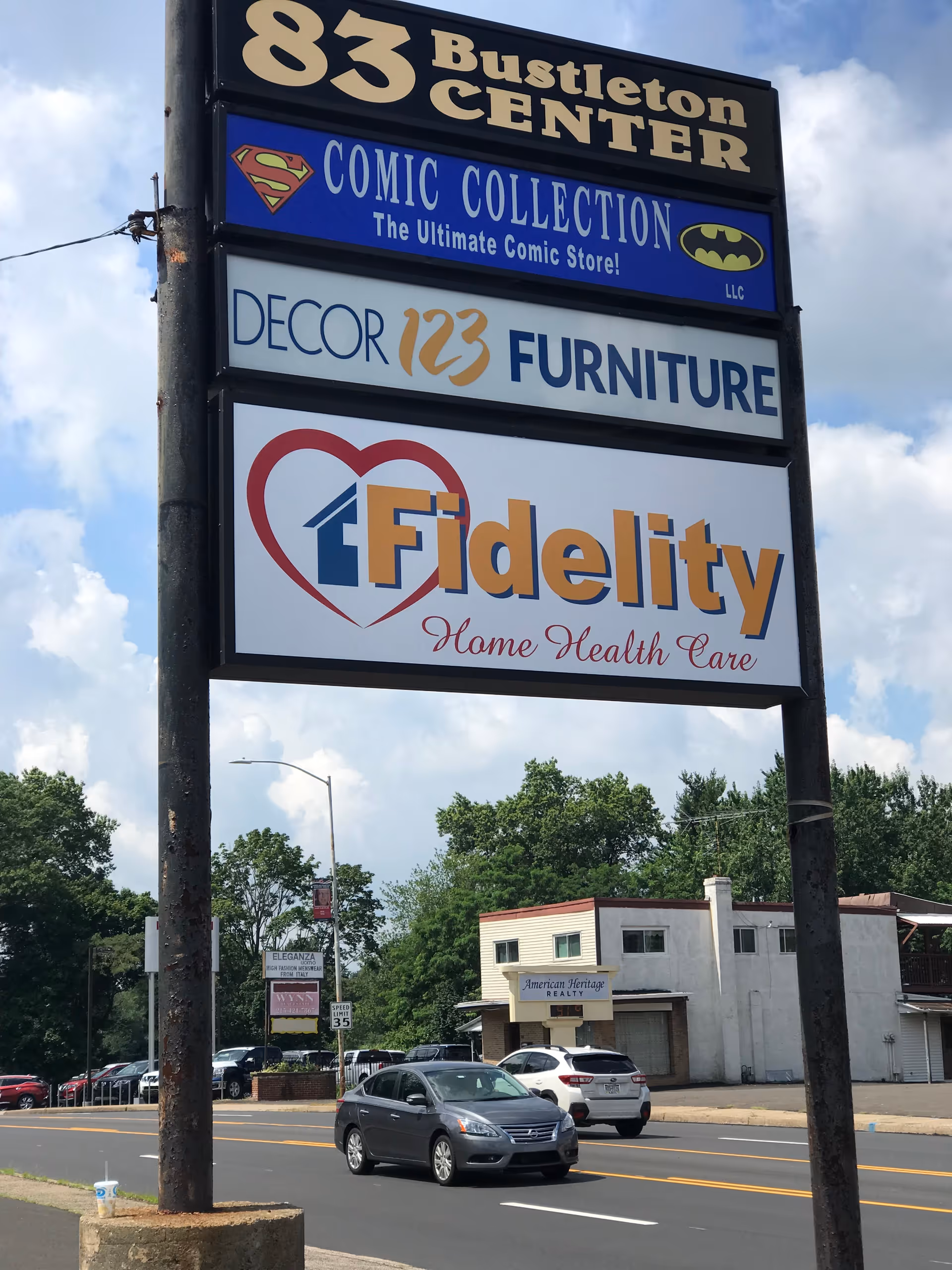 Large outdoor signboard displaying Fidelity Home Health Care logo by the street.