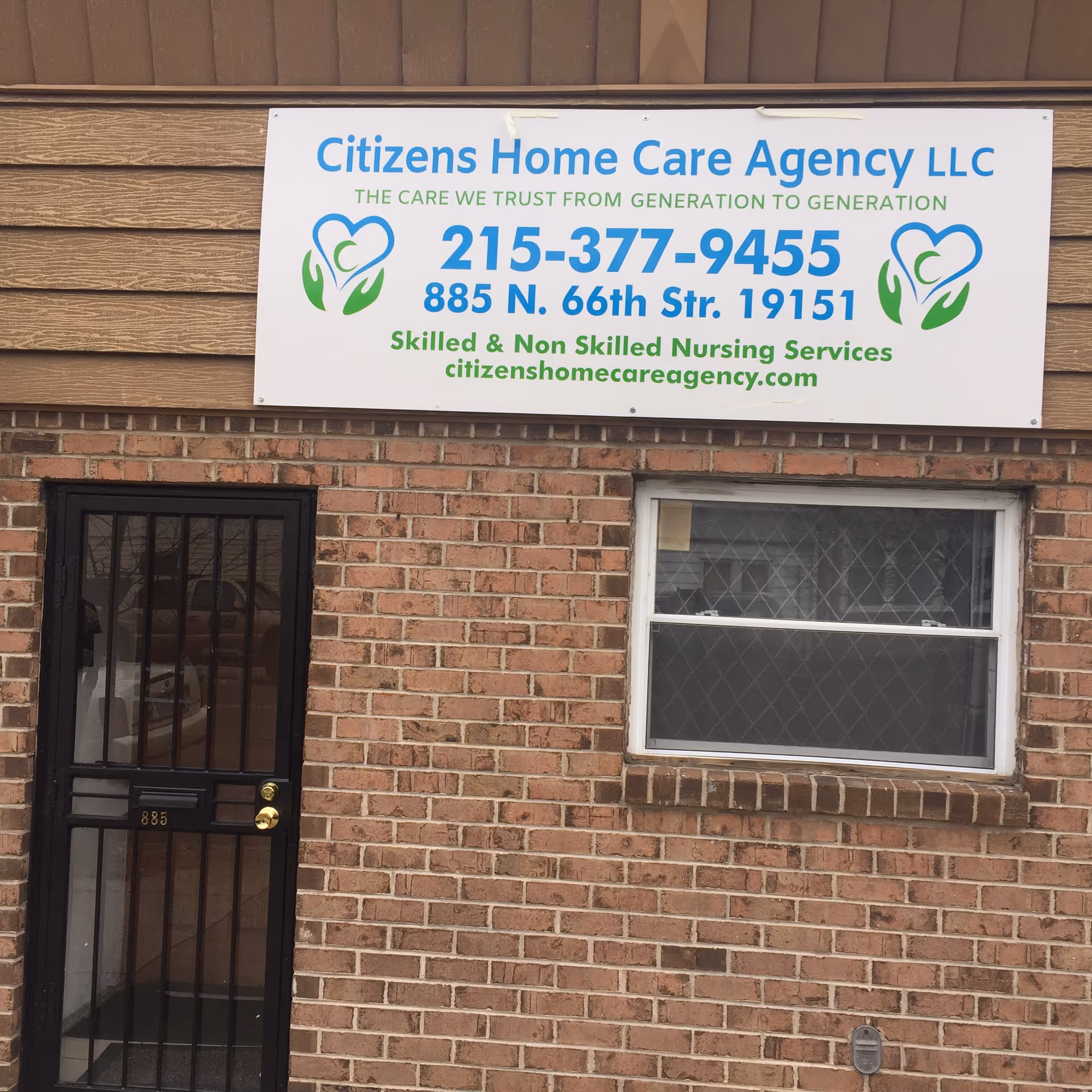 Brick building facade with Citizens Home Care Agency LLC sign above a door and window