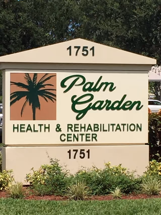 Outdoor sign reading "Palm Garden Health & Rehabilitation Center" with a palm tree logo and the address 1751.