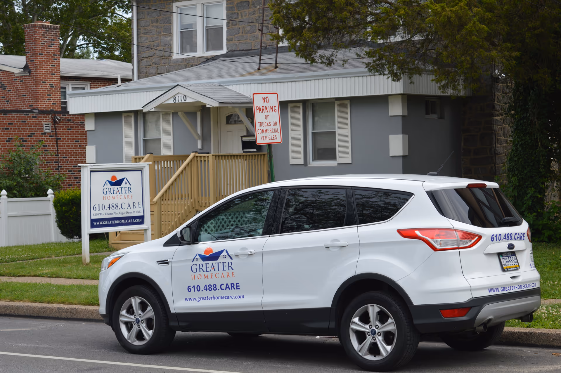 Exterior shot of a building front with a Greater Homecare van parked on the street