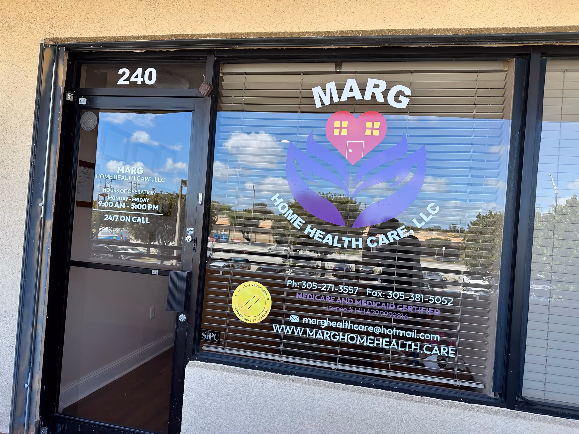 Front entrance of Marg Home Health Care LLC with logo on glass window and address 240.