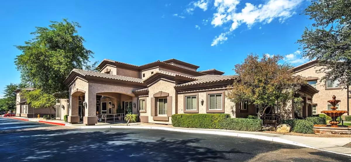 Exterior view of Sparks Community New Day PCH building with entrance and fountain.
