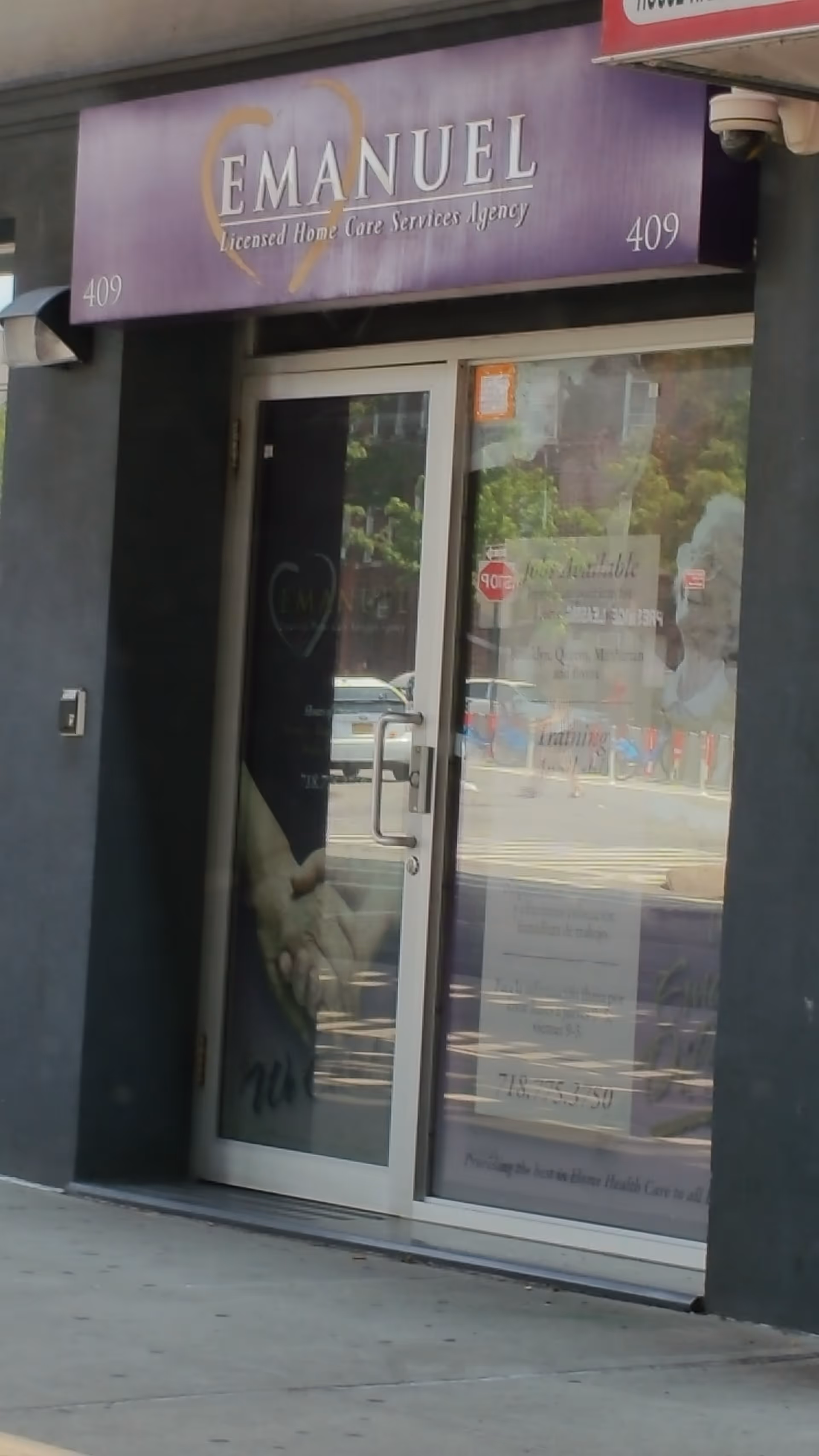Storefront entrance with purple Emanuel Home Care sign above glass doors.