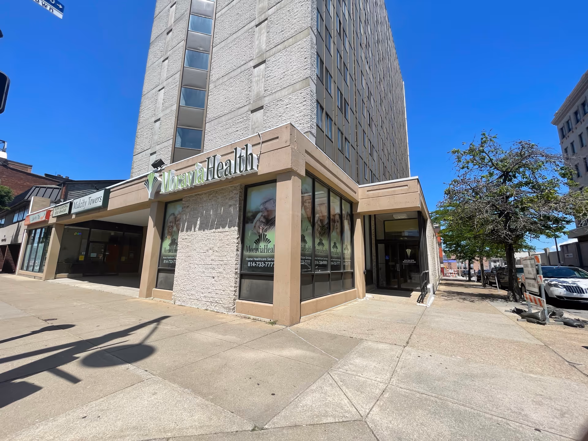 Corner view of Moravia Health Erie building with glass storefront windows.