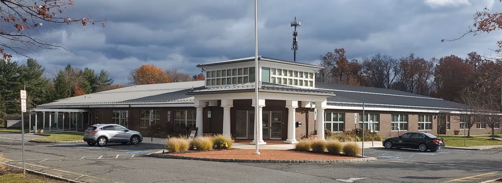 Exterior view of Atlantic Adult Day Center with a portico entrance.