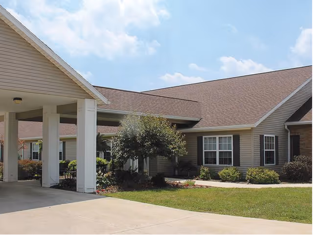 Exterior of Riverside Landing Skilled Nursing and Rehabilitation with entrance canopy and landscaped grounds.