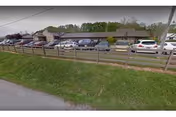 Exterior view of Ohio Valley Health Care with a parking lot and fence.