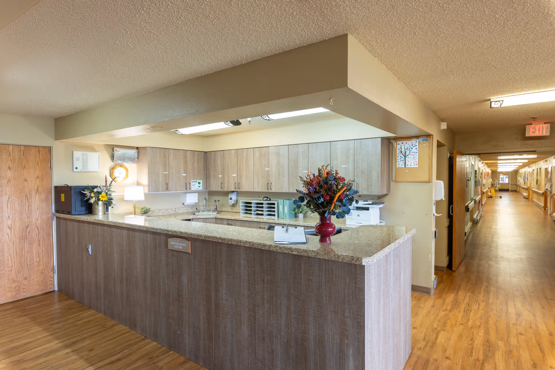 Interior reception area at Sage View Care Center with a long hallway and granite counter.