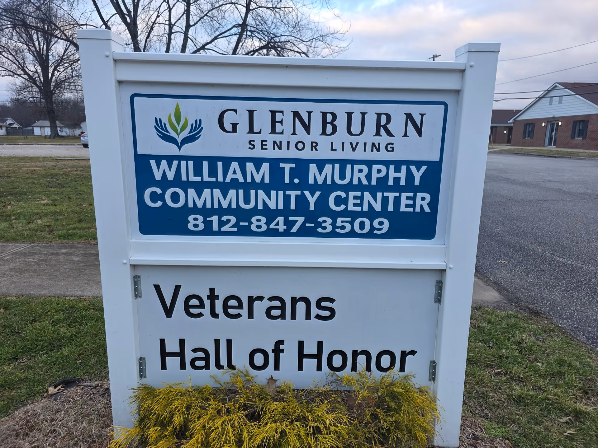 White outdoor sign for Glenburn Senior Living, William T. Murphy Community Center, Veterans Hall of Honor.