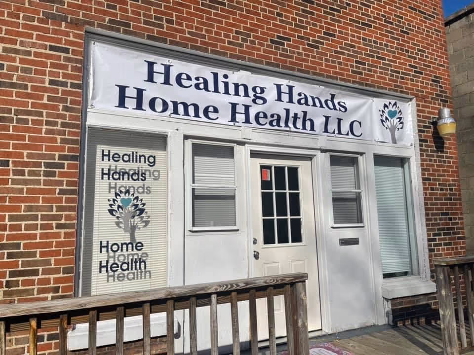 Brick storefront with Healing Hands Home Health LLC sign and entrance