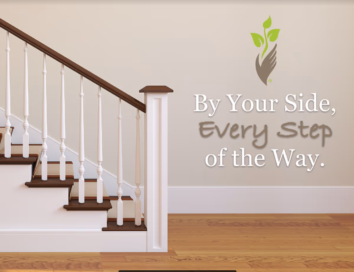 Indoor staircase with white balusters and wall text 'By Your Side, Every Step of the Way'.