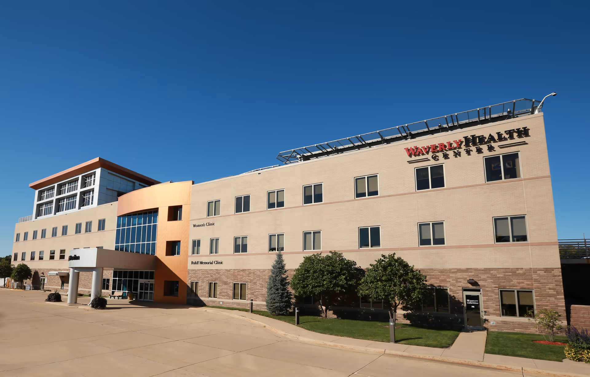 Exterior view of Waverly Health Center building under a clear blue sky.