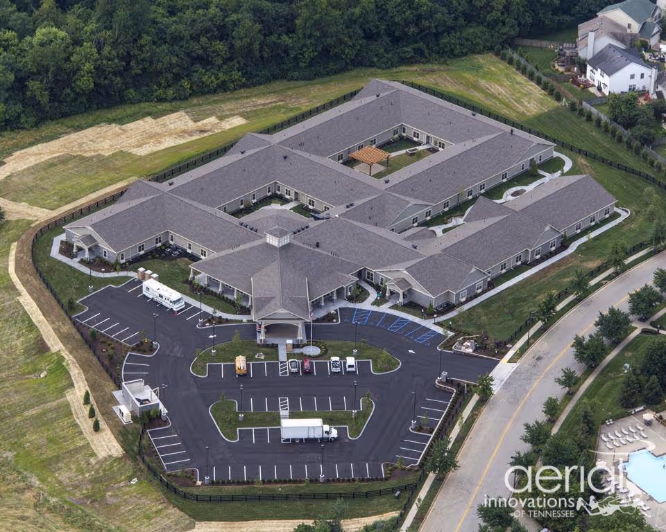 Aerial view of Morning Pointe of Lexington-East senior living campus with parking.