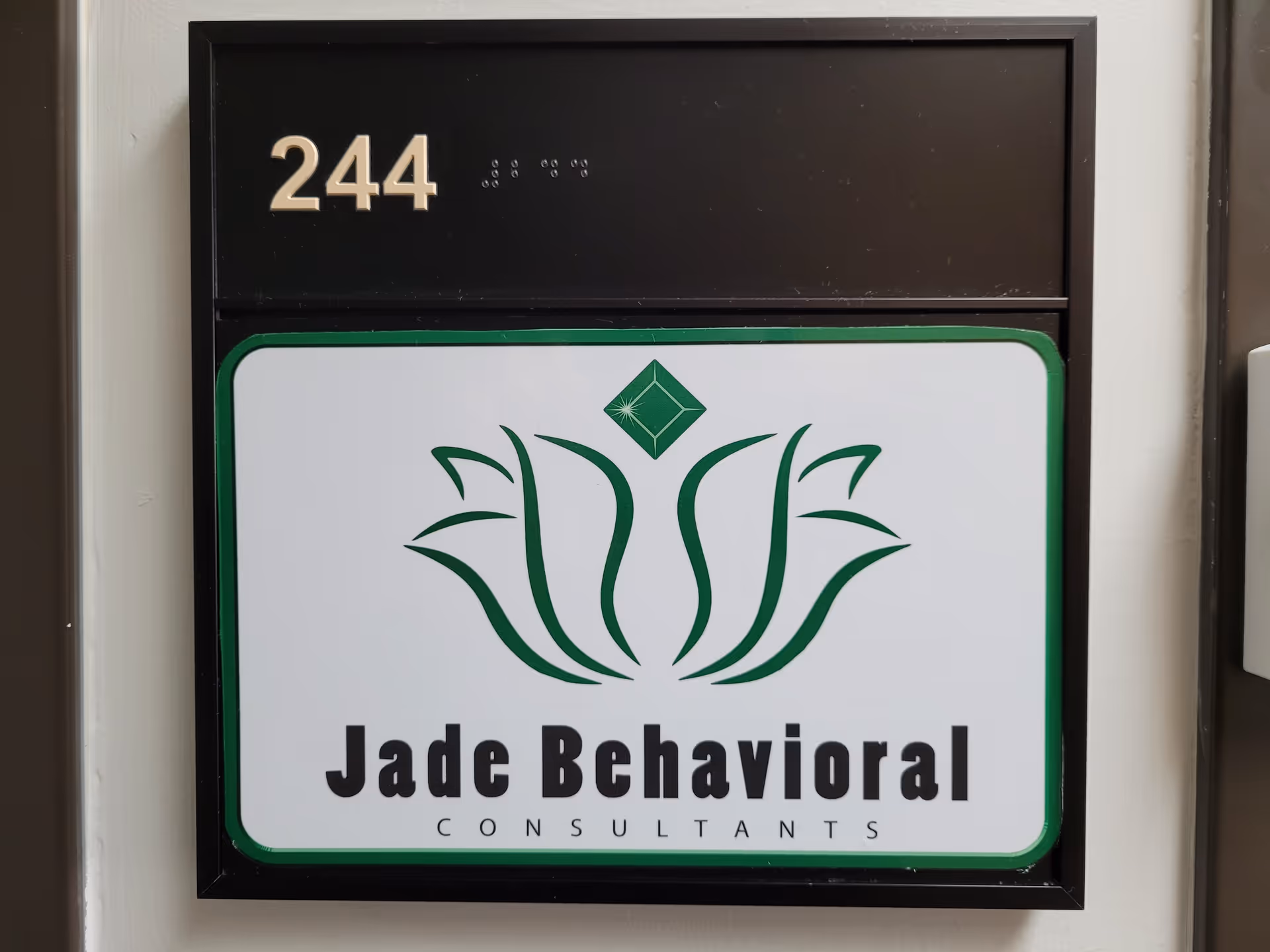 Exterior sign showing 244 and the Jade Behavioral Consultants logo.