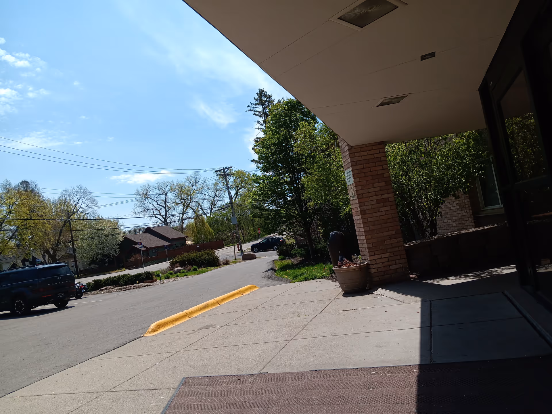 Outdoor entrance area of The Villa at Bryn Mawr with brick column and walkway