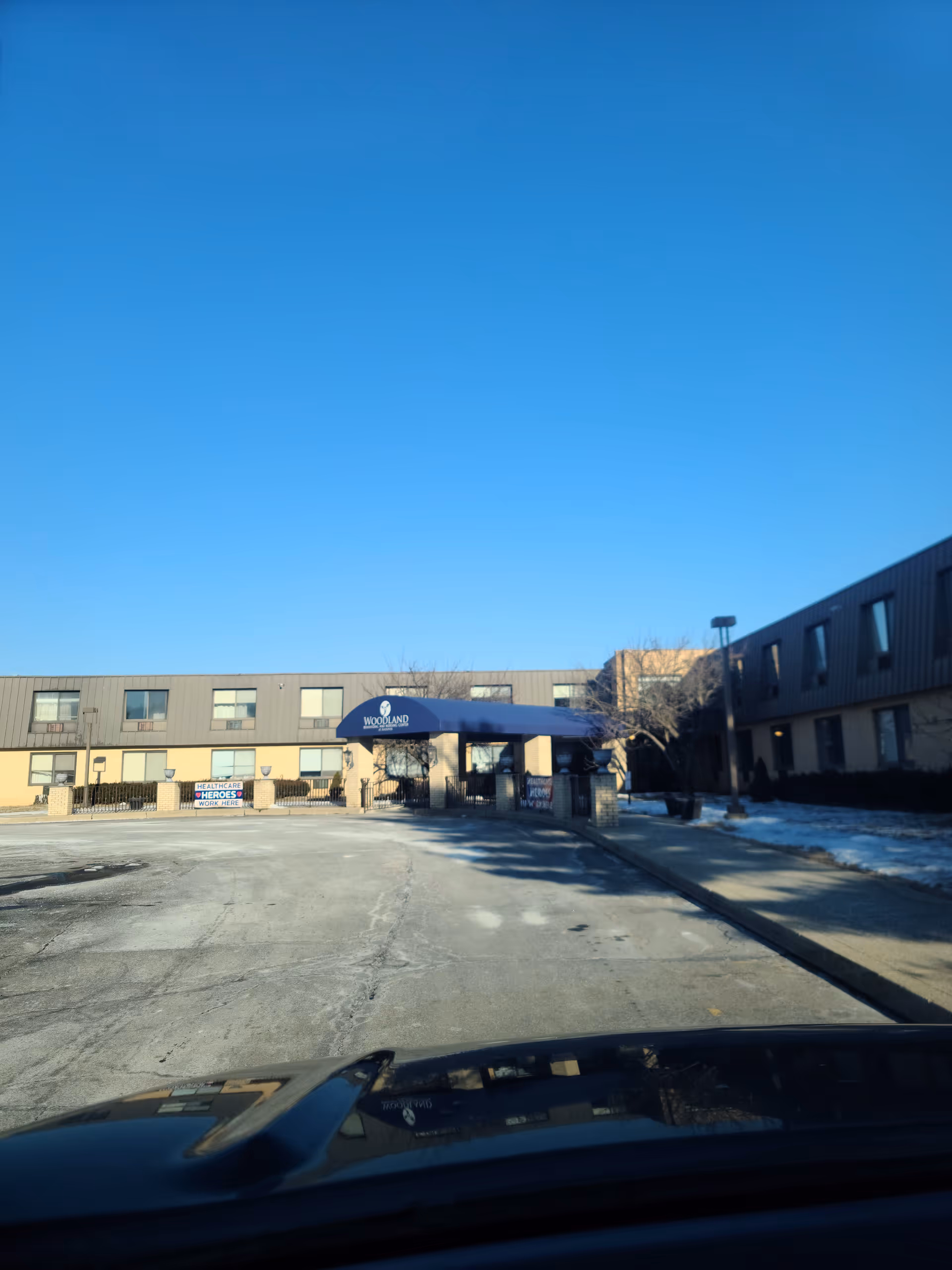 Exterior view of Andover Subacute and Rehab II building with blue entrance canopy