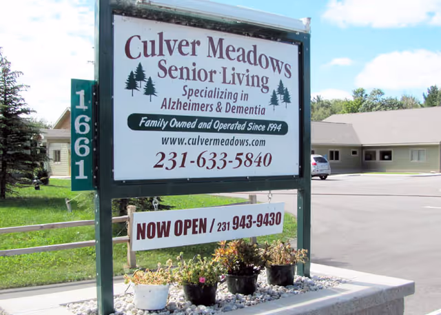 A large Culver Meadows Senior Living sign stands outside a building.