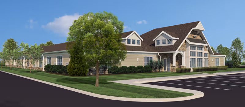 Exterior view of Vitalia Senior Residences at Strongsville with landscaped grounds and parking.