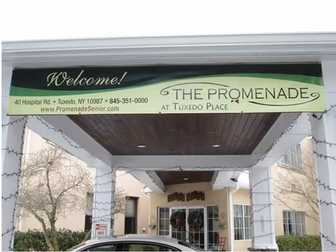 Entrance to Promenade at Tuxedo Place senior living with welcome banner