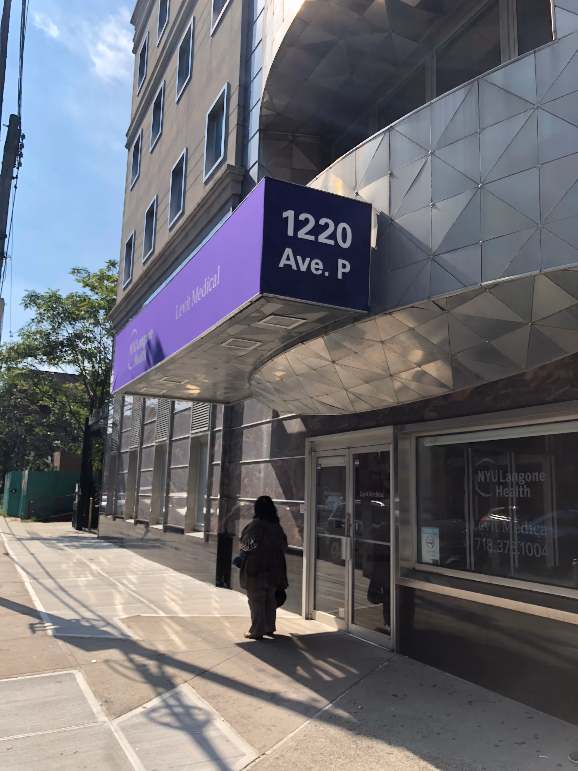 Exterior view of NYU Langone Levit Medical entrance with a purple sign