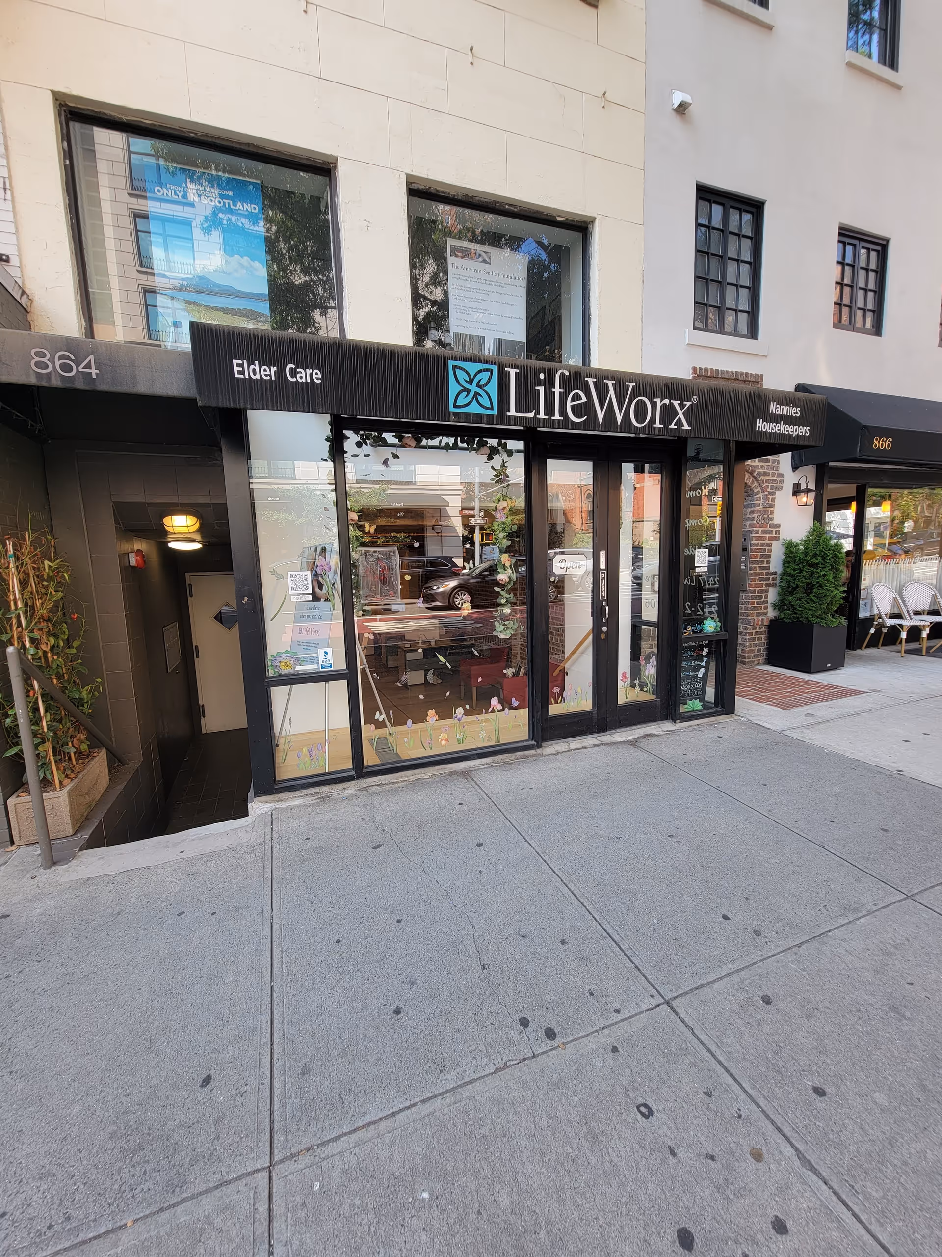 Exterior storefront of LifeWorx Home Care with glass doors and signage.
