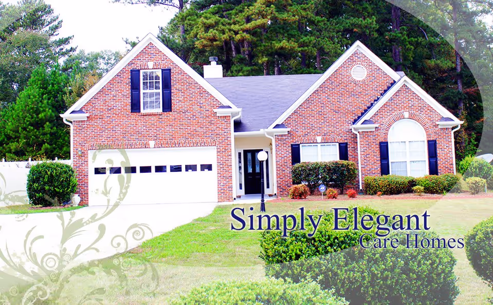 Front view of a brick suburban house with a garage, lawn, and shrubs with overlaid text branding.