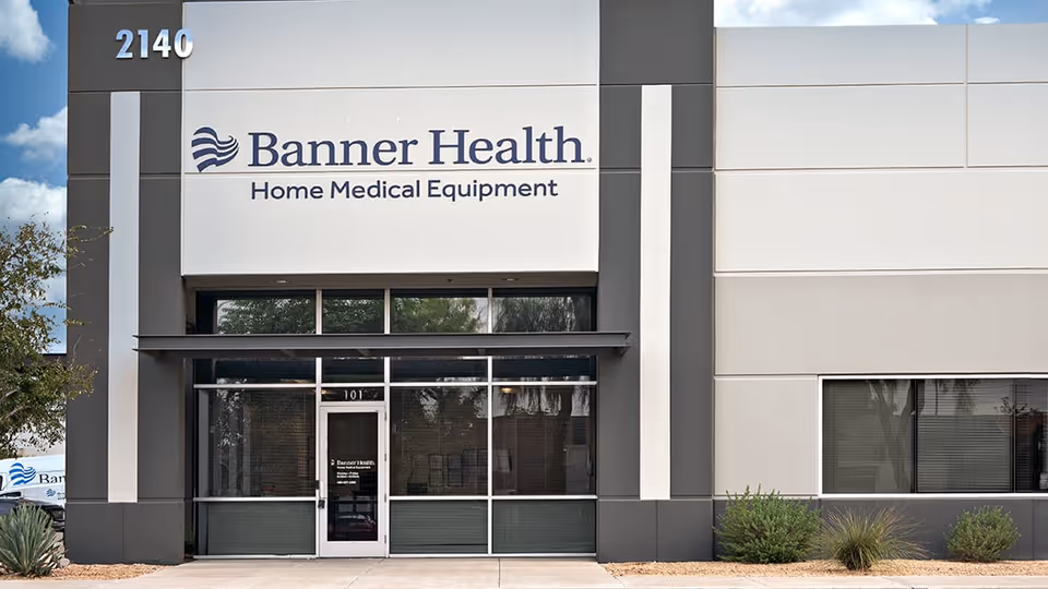 Modern medical equipment building featuring Banner Health sign and glass entry doors.