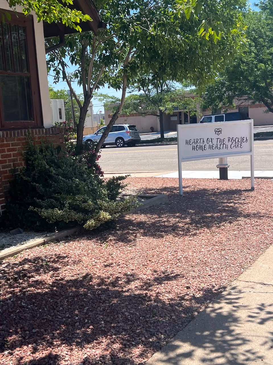 Exterior view of a facility with a sign reading Hearts of the Rockies Home Health Care.