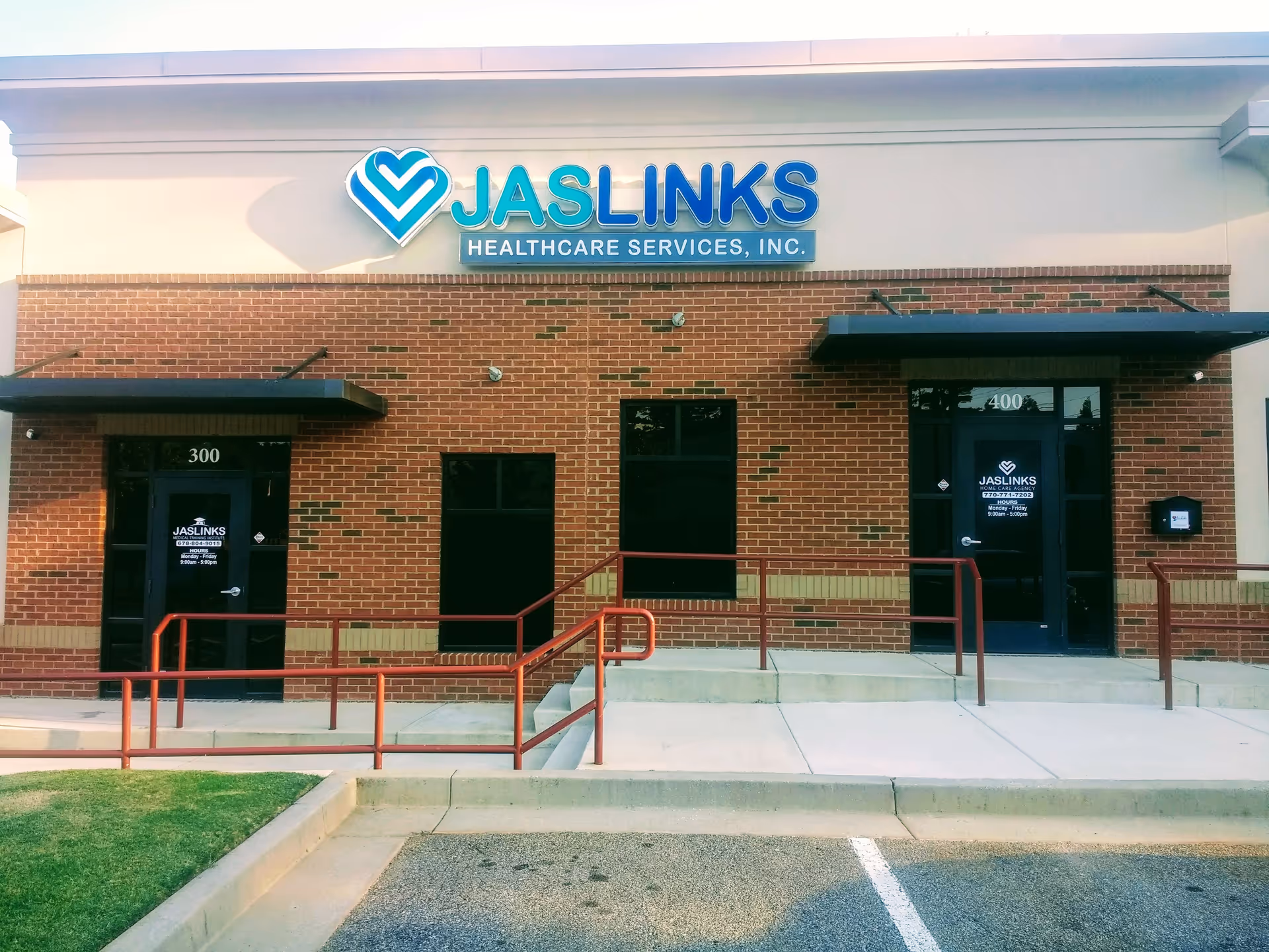Brick building exterior featuring JASLINKS Healthcare Services sign above two entrances.