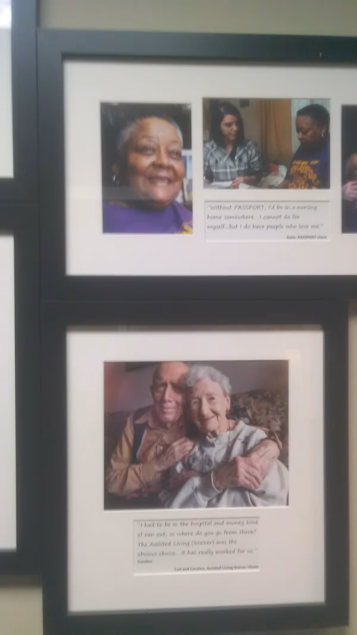 Framed photos of elderly residents displayed on a wall inside a senior living facility.