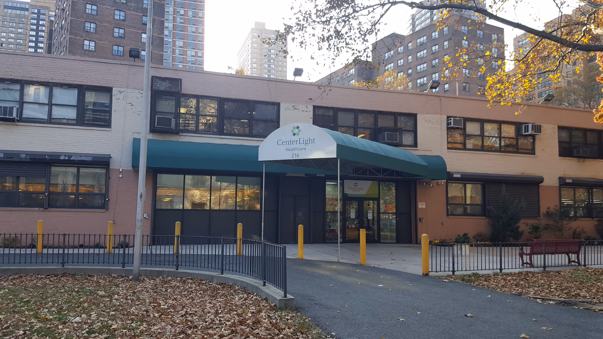 Exterior front of CenterLight Healthcare facility with a green awning and entrance.