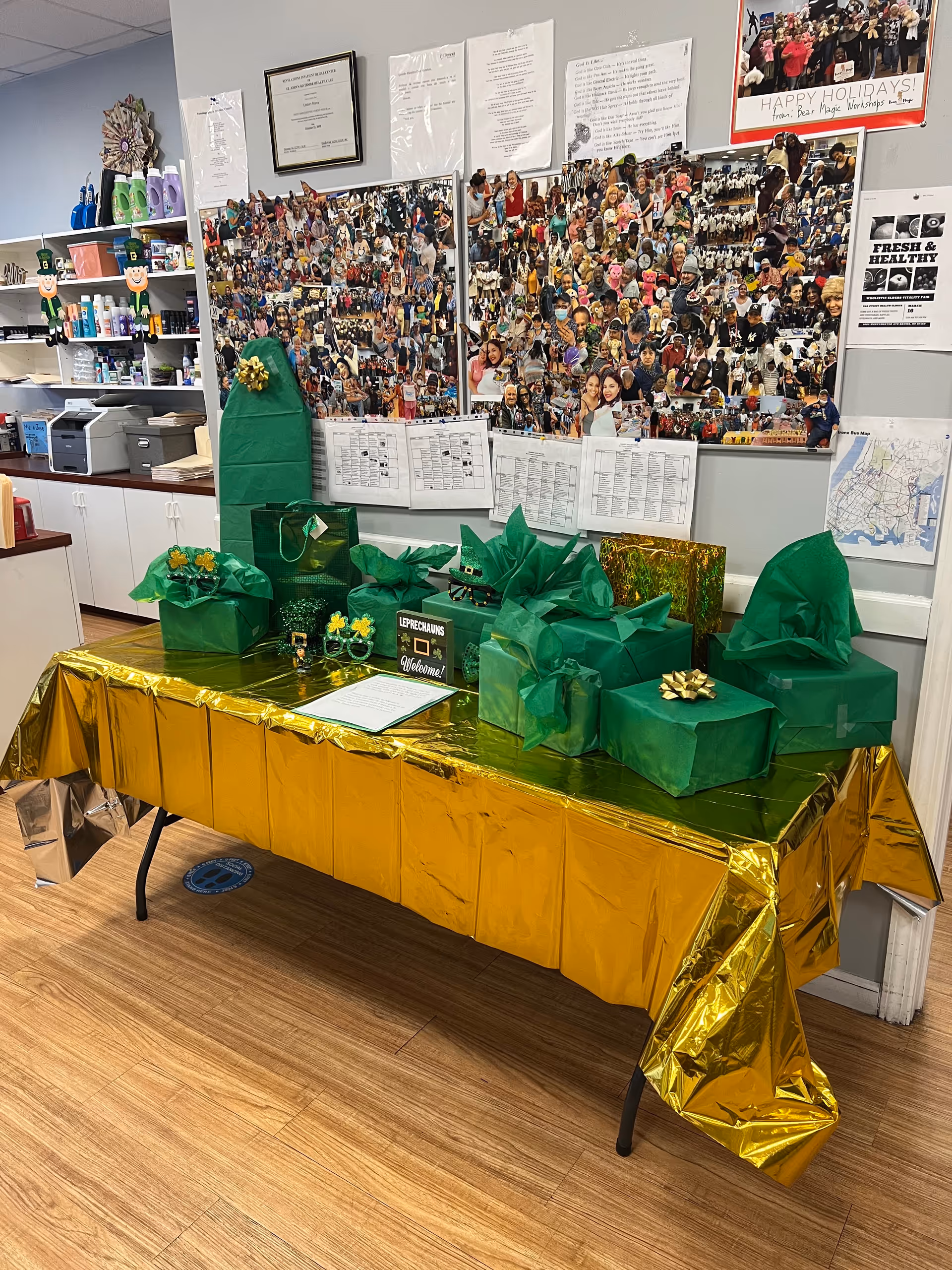 Decorated table with green and gold gift boxes in an adult day care center.