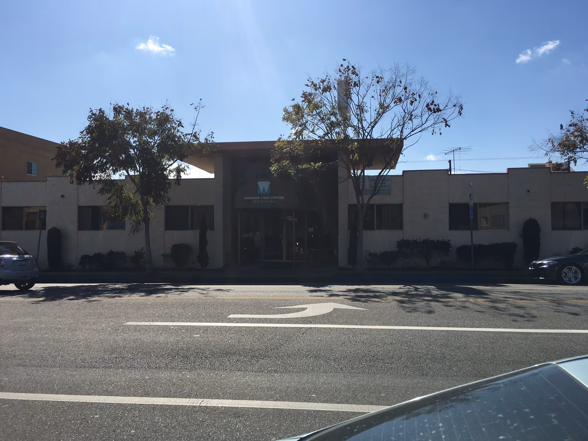 Front view of Windsor Care Center of Cheviot Hills with entrance and parked cars