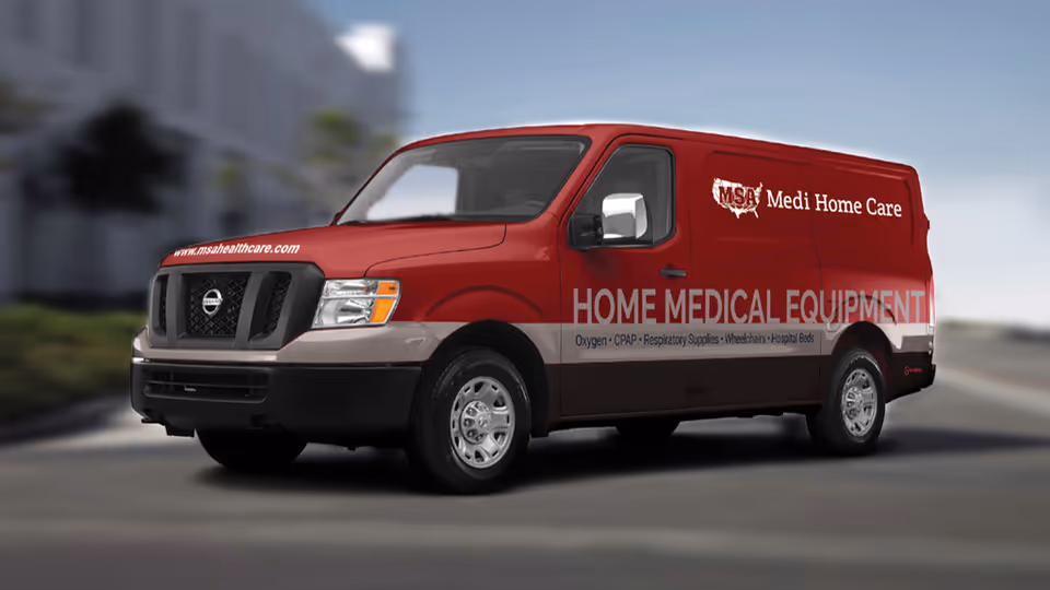 Red van labeled Home Medical Equipment for MSA Medi Home Care parked on street.
