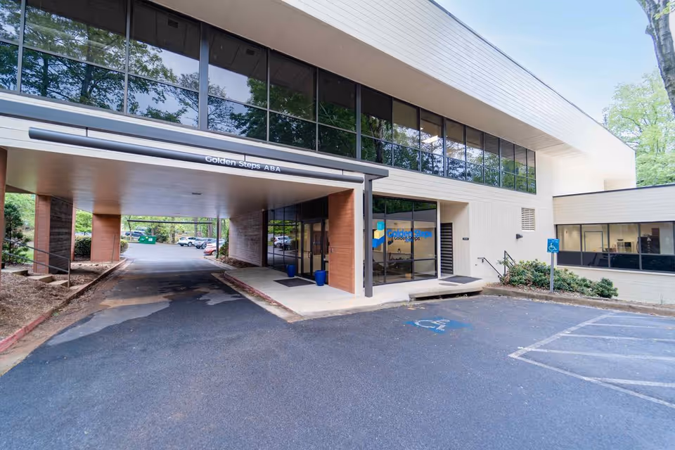 Exterior view of Golden Steps ABA building with glass windows and accessible entrance.