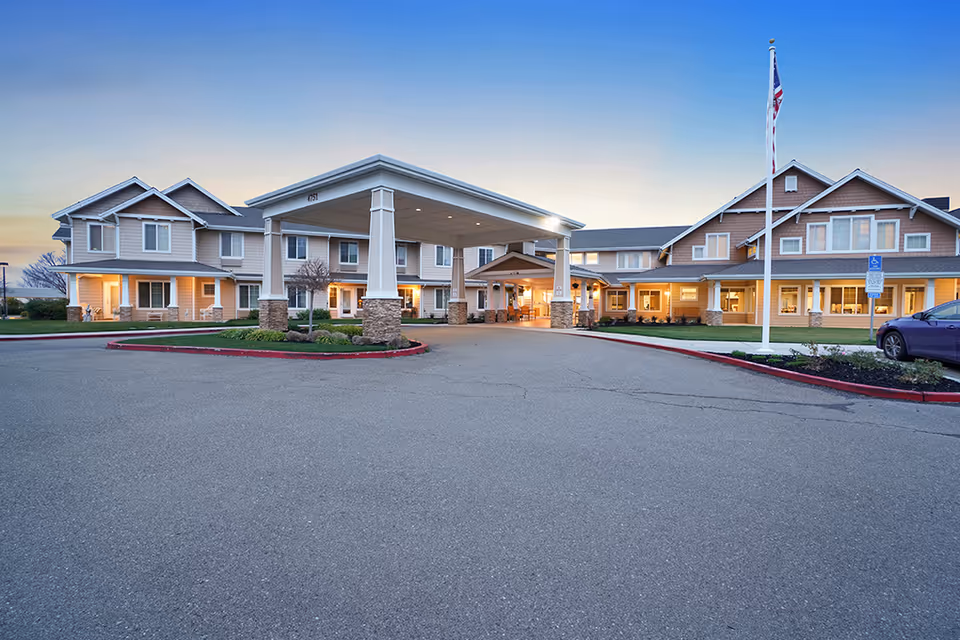 Exterior view of The Commons at Dallas Ranch entrance with a covered drop-off canopy.