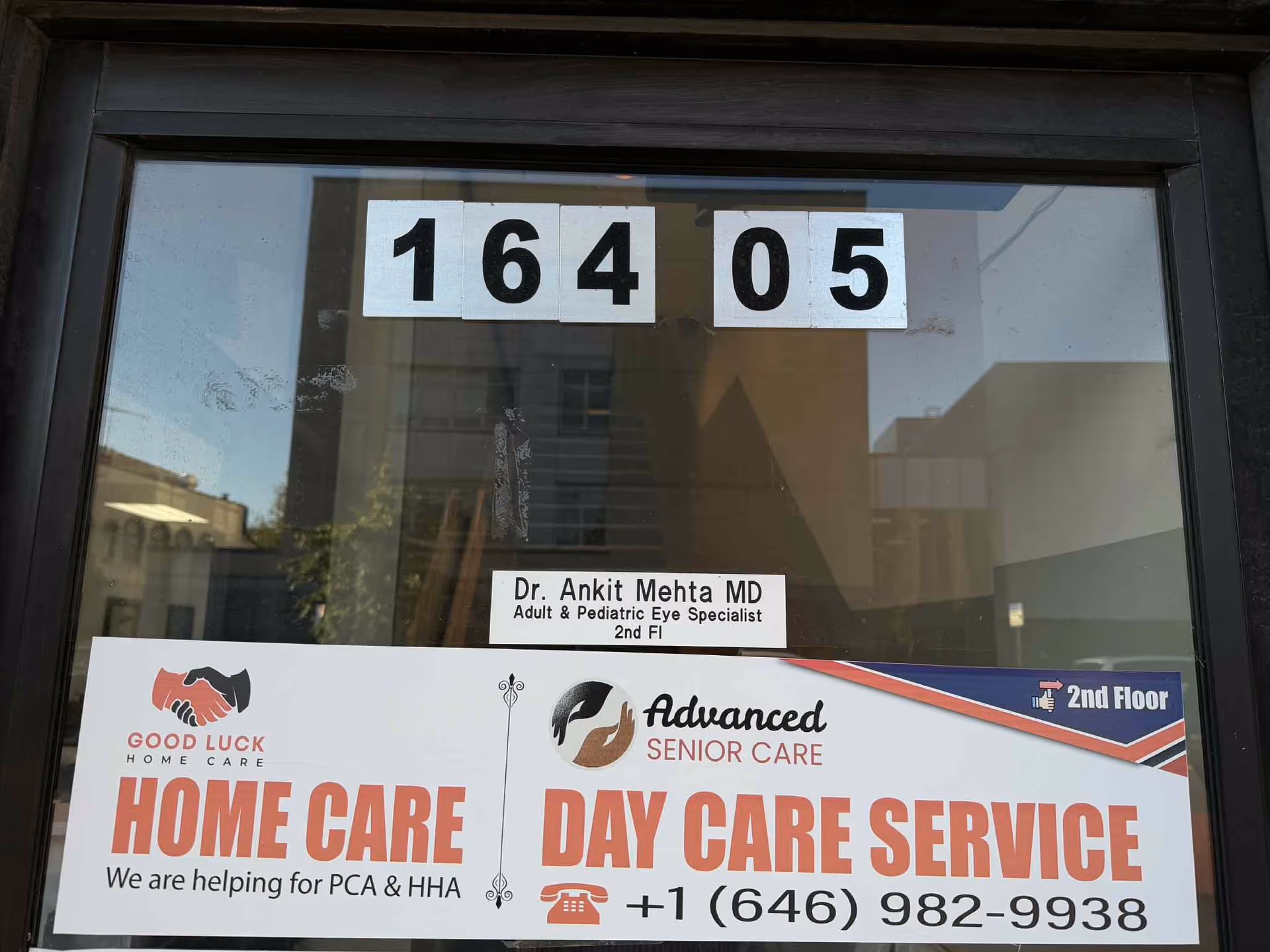 Storefront window shows Good Luck Home Care signage and a Day Care Service banner.