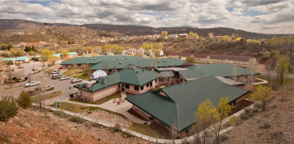 Aerial view of Sunshine Gardens West Assisted Living campus with green roofs.