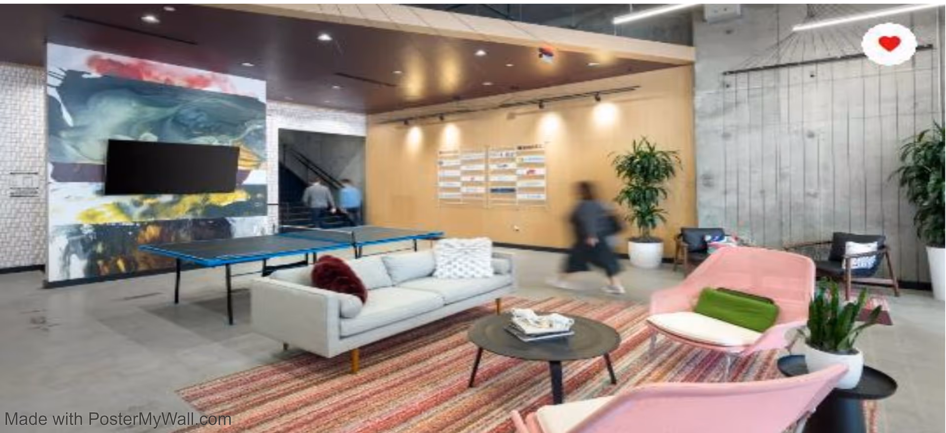 Modern lobby lounge with seating, rug, coffee table, ping-pong table, and passing residents.