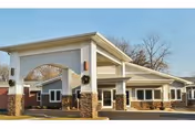 Exterior view of Fair Oaks Health Care Center entrance with pillars and stone accents.