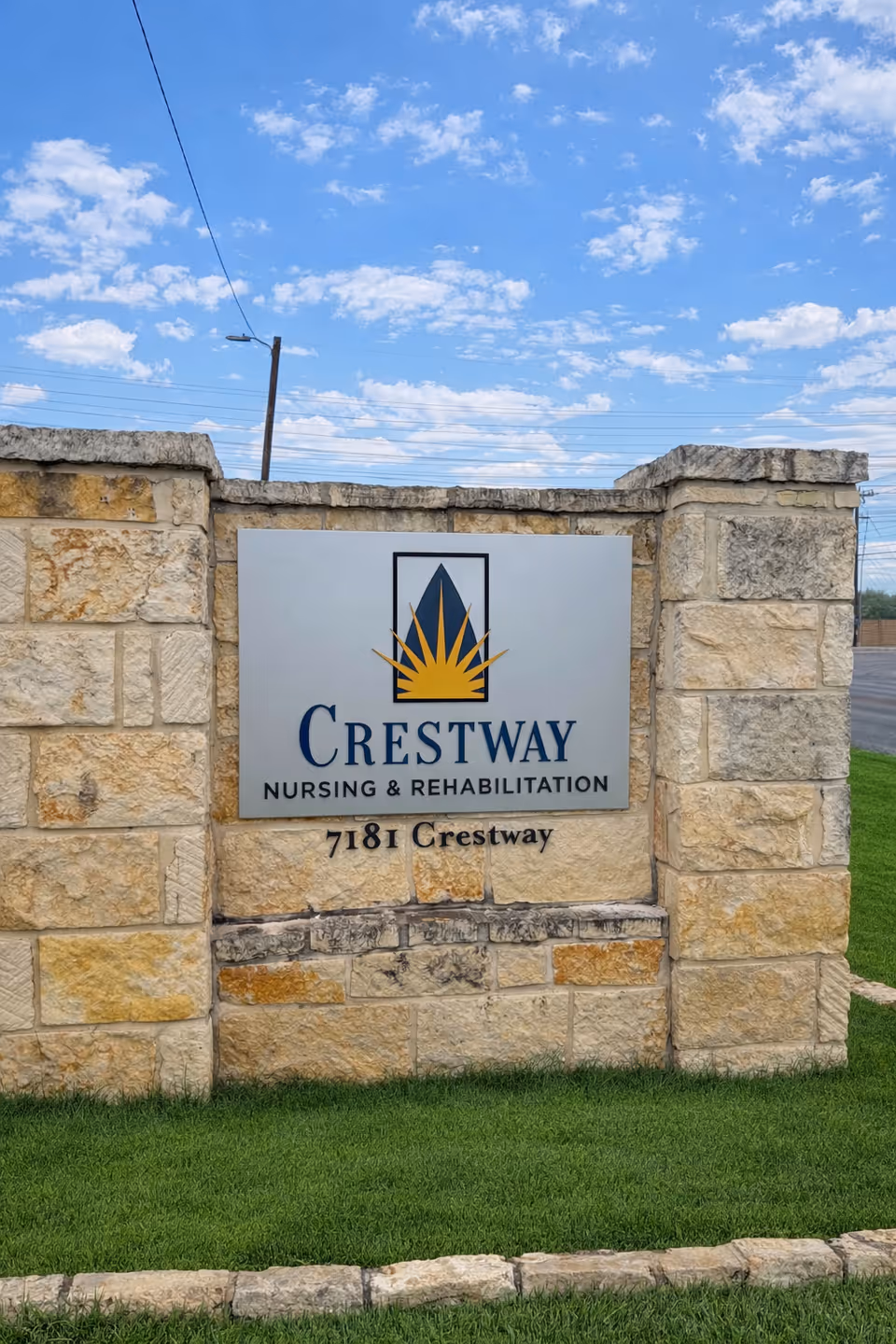 Stone entrance wall displaying Crestway Nursing & Rehabilitation sign and address 7181 Crestway.